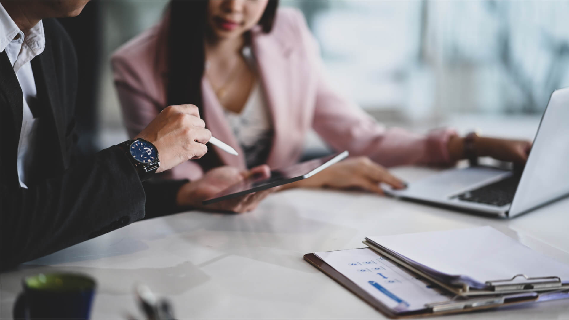 man and woman working together for a meeting with a virtual assistant