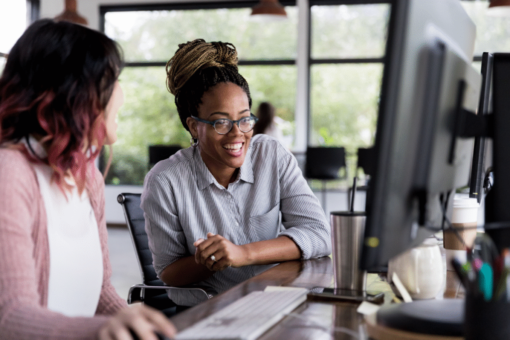 virtual assistants discussing in front of a computer