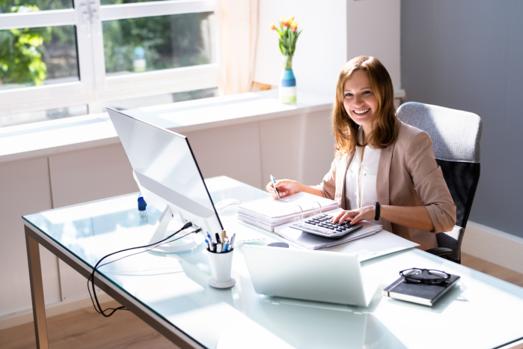Woman in her office doing bookkeeping and data entry