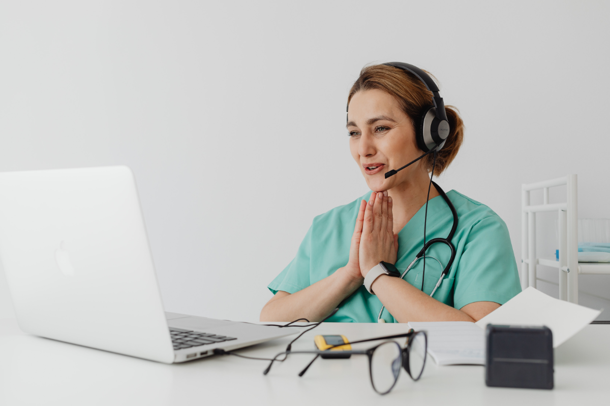 Medical VA wearing headphones on a call