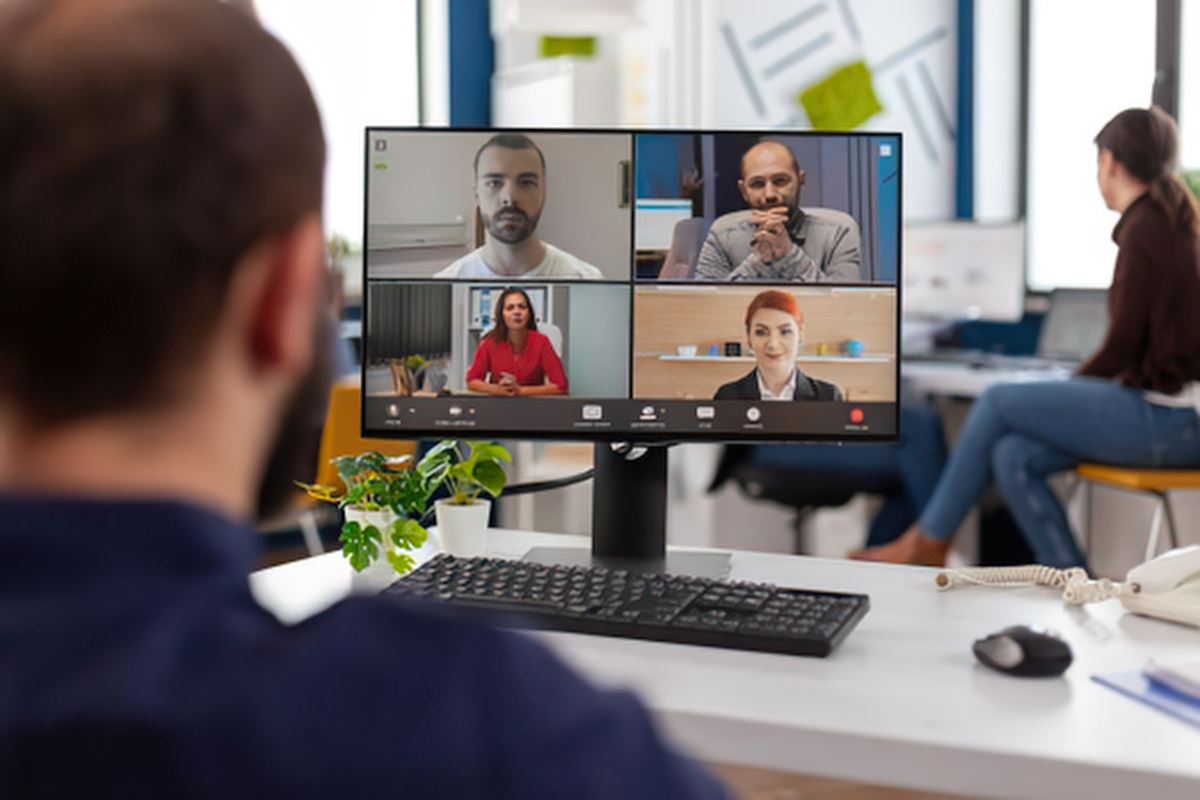 CEO talking to remote employees via online meeting